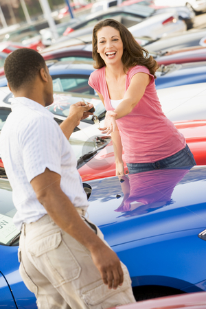 To use this stock image in your creative project, please select the size you need over to the right and click the "Add to Cart" button.
Your downloaded image will come with the Cutcaster watermark removed so don’t worry about the watermark you see on this page. Woman picking up keys to new car stock photo, Woman picking up keys to new car from salesman by Monkey Business Images
