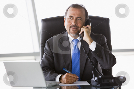 To use this stock image in your creative project, please select the size you need over to the right and click the "Add to Cart" button.
Your downloaded image will come with the Cutcaster watermark removed so don’t worry about the watermark you see on this page. Businessman talking on phone stock photo, Businessman talking on phone in office by Monkey Business Images