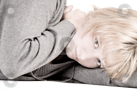 To use this stock image in your creative project, please select the size you need over to the right and click the "Add to Cart" button.
Your downloaded image will come with the Cutcaster watermark removed so don’t worry about the watermark you see on this page. Sad looking beautiful girl lying on the floor looking at you stock photo, Studio portrait of a red haired beauty looking sad by Frenk and Danielle Kaufmann