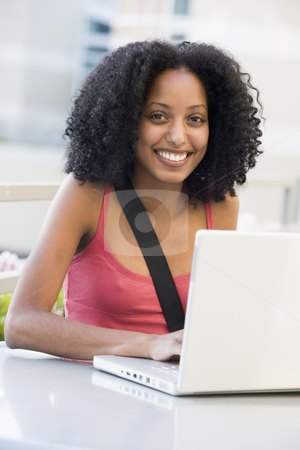 To use this stock image in your creative project, please select the size you need over to the right and click the "Add to Cart" button.
Your downloaded image will come with the Cutcaster watermark removed so don’t worry about the watermark you see on this page. Female student using laptop outside stock photo, Female university student using laptop outside by Monkey Business Images