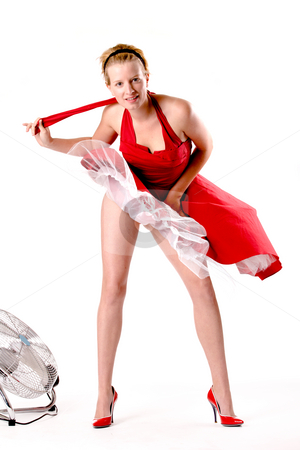 To use this stock image in your creative project, please select the size you need over to the right and click the "Add to Cart" button.
Your downloaded image will come with the Cutcaster watermark removed so don’t worry about the watermark you see on this page. Funny girl in red gala dress playing sexy with a ventilator stock photo, Girl in red gala dress making fun with a ventilator by Frenk and Danielle Kaufmann