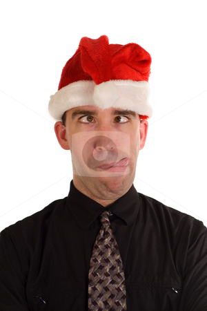 To use this stock image in your creative project, please select the size you need over to the right and click the "Add to Cart" button.
Your downloaded image will come with the Cutcaster watermark removed so don’t worry about the watermark you see on this page. Silly Christmas Employee stock photo, An employee making a funny face while wearing a Christmas hat by Richard Nelson