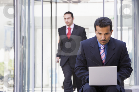 To use this stock image in your creative project, please select the size you need over to the right and click the "Add to Cart" button.
Your downloaded image will come with the Cutcaster watermark removed so don’t worry about the watermark you see on this page. Businessman using laptop outside stock photo, Businessman using laptop outsidde office by Monkey Business Images