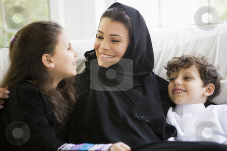 To use this stock image in your creative project, please select the size you need over to the right and click the "Add to Cart" button.
Your downloaded image will come with the Cutcaster watermark removed so don’t worry about the watermark you see on this page. A Middle Eastern woman with her children stock photo, by Monkey Business Images