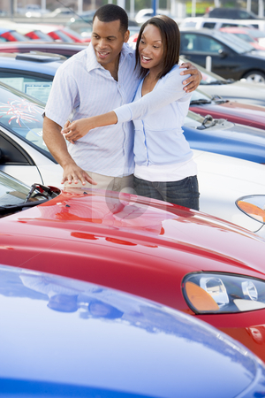 To use this stock image in your creative project, please select the size you need over to the right and click the "Add to Cart" button.
Your downloaded image will come with the Cutcaster watermark removed so don’t worry about the watermark you see on this page. Young couple looking at new cars stock photo, Young couple looking at new cars on lot by Monkey Business Images