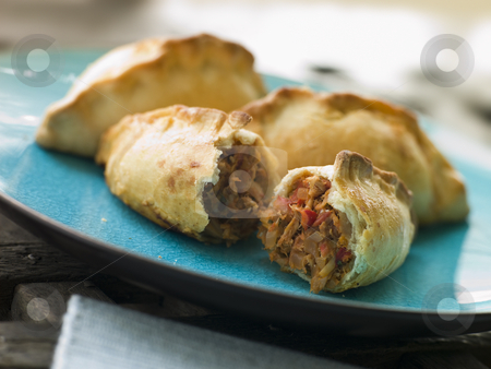 To use this stock image in your creative project, please select the size you need over to the right and click the "Add to Cart" button.
Your downloaded image will come with the Cutcaster watermark removed so don’t worry about the watermark you see on this page. Tuna Empanadas stock photo, by Monkey Business Images