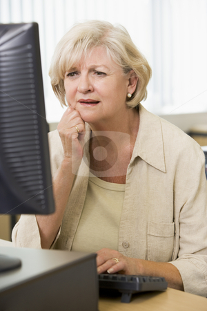 To use this stock image in your creative project, please select the size you need over to the right and click the "Add to Cart" button.
Your downloaded image will come with the Cutcaster watermark removed so don’t worry about the watermark you see on this page. Confused woman frowning at computer monitor stock photo, by Monkey Business Images
