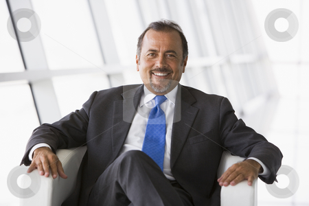 To use this stock image in your creative project, please select the size you need over to the right and click the "Add to Cart" button.
Your downloaded image will come with the Cutcaster watermark removed so don’t worry about the watermark you see on this page. Businessman sitting in office lobby stock photo, Businessman sitting in chair in office lobby by Monkey Business Images