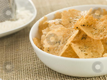 To use this stock image in your creative project, please select the size you need over to the right and click the "Add to Cart" button.
Your downloaded image will come with the Cutcaster watermark removed so don’t worry about the watermark you see on this page. Dish of Parmesan Crisps stock photo, by Monkey Business Images