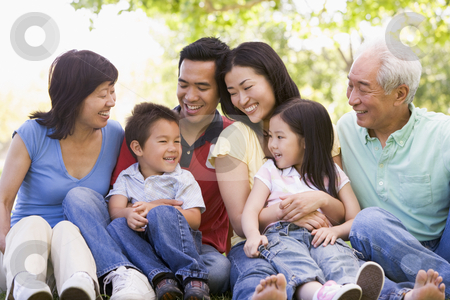 To use this stock image in your creative project, please select the size you need over to the right and click the "Add to Cart" button.
Your downloaded image will come with the Cutcaster watermark removed so don’t worry about the watermark you see on this page. Extended family sitting outdoors smiling stock photo, by Monkey Business Images