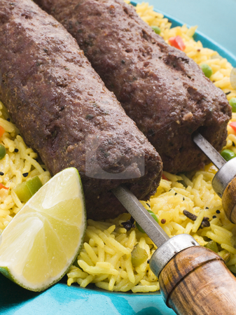 To use this stock image in your creative project, please select the size you need over to the right and click the "Add to Cart" button.
Your downloaded image will come with the Cutcaster watermark removed so don’t worry about the watermark you see on this page. Lamb Mint and Garlic Sheesh Kebab with Pilau Rice stock photo, by Monkey Business Images