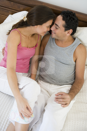 To use this stock image in your creative project, please select the size you need over to the right and click the "Add to Cart" button.
Your downloaded image will come with the Cutcaster watermark removed so don’t worry about the watermark you see on this page. A Middle Eastern couple lying on a bed stock photo, by Monkey Business Images