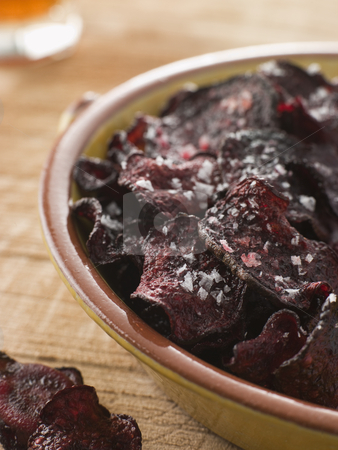 To use this stock image in your creative project, please select the size you need over to the right and click the "Add to Cart" button.
Your downloaded image will come with the Cutcaster watermark removed so don’t worry about the watermark you see on this page. Beetroot Crisps with Sea Salt stock photo, by Monkey Business Images