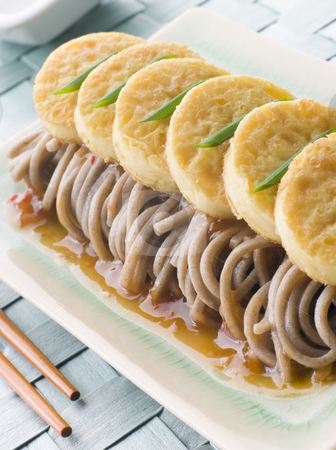 To use this stock image in your creative project, please select the size you need over to the right and click the "Add to Cart" button.
Your downloaded image will come with the Cutcaster watermark removed so don’t worry about the watermark you see on this page. Fried Silken Tofu on Noodle Salad stock photo, Plate of Fried Silken Tofu on Noodle Salad with chopsticks by Monkey Business Images