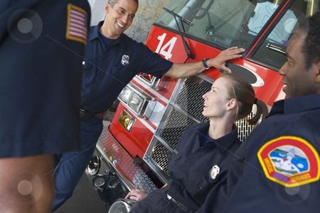 To use this stock image in your creative project, please select the size you need over to the right and click the "Add to Cart" button.
Your downloaded image will come with the Cutcaster watermark removed so don’t worry about the watermark you see on this page. Firefighters chatting by a fire engine stock photo, by Monkey Business Images