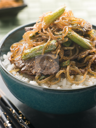 To use this stock image in your creative project, please select the size you need over to the right and click the "Add to Cart" button.
Your downloaded image will come with the Cutcaster watermark removed so don’t worry about the watermark you see on this page. Sweet Soy Beef Fillet With Shirakaki Noodles on Rice with Shichi stock photo, Bowl of Sweet Soy Beef Fillet With Shirakaki Noodles on Rice with Sprinkled with Shichimi Togarashi Pepper by Monkey Business Images