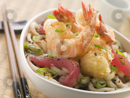 To use this stock image in your creative project, please select the size you need over to the right and click the "Add to Cart" button.
Your downloaded image will come with the Cutcaster watermark removed so don’t worry about the watermark you see on this page. Bowl of Tempura Tiger Prawn and Udon Noodle Broth with Yellow Fi stock photo, Bowl of Tempura Tiger Prawn and Udon Noodle Broth with Yellow Fin tuna and chopsticks by Monkey Business Images