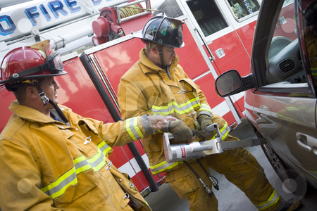 To use this stock image in your creative project, please select the size you need over to the right and click the "Add to Cart" button.
Your downloaded image will come with the Cutcaster watermark removed so don’t worry about the watermark you see on this page. Firefighters cutting open a car to help an injured person stock photo, by Monkey Business Images