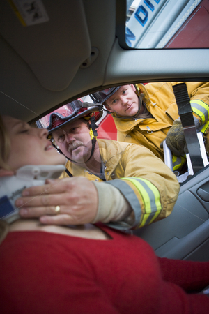 To use this stock image in your creative project, please select the size you need over to the right and click the "Add to Cart" button.
Your downloaded image will come with the Cutcaster watermark removed so don’t worry about the watermark you see on this page. Firefighters helping an injured woman in a car stock photo, by Monkey Business Images