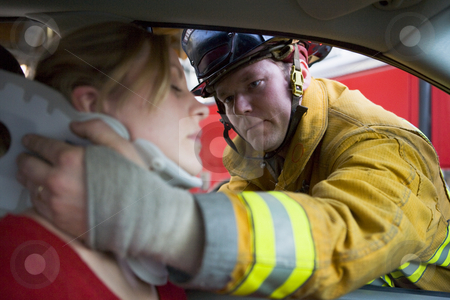 To use this stock image in your creative project, please select the size you need over to the right and click the "Add to Cart" button.
Your downloaded image will come with the Cutcaster watermark removed so don’t worry about the watermark you see on this page. Firefighters helping an injured woman in a car stock photo, by Monkey Business Images