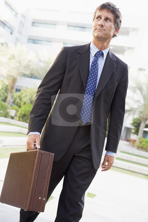 To use this stock image in your creative project, please select the size you need over to the right and click the "Add to Cart" button.
Your downloaded image will come with the Cutcaster watermark removed so don’t worry about the watermark you see on this page. Businessman walking outdoors stock photo, by Monkey Business Images