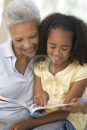 To use this stock image in your creative project, please select the size you need over to the right and click the "Add to Cart" button.
Your downloaded image will come with the Cutcaster watermark removed so don’t worry about the watermark you see on this page. Grandmother and granddaughter reading and smiling stock photo, by Monkey Business Images