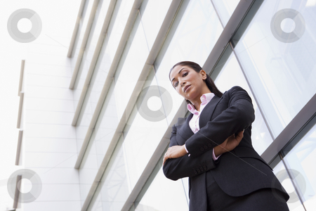 To use this stock image in your creative project, please select the size you need over to the right and click the "Add to Cart" button.
Your downloaded image will come with the Cutcaster watermark removed so don’t worry about the watermark you see on this page. Businesswoman standing outside office building stock photo, Businesswoman standing outside modern office building by Monkey Business Images
