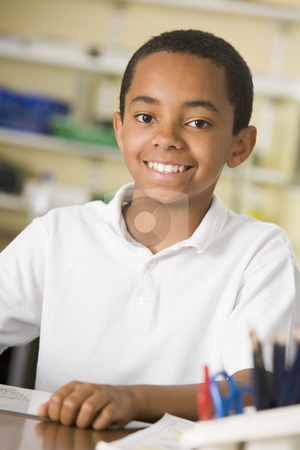 To use this stock image in your creative project, please select the size you need over to the right and click the "Add to Cart" button.
Your downloaded image will come with the Cutcaster watermark removed so don’t worry about the watermark you see on this page. A schoolboy studying in class stock photo, by Monkey Business Images