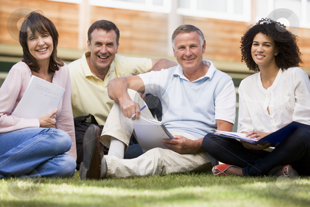 To use this stock image in your creative project, please select the size you need over to the right and click the "Add to Cart" button.
Your downloaded image will come with the Cutcaster watermark removed so don’t worry about the watermark you see on this page. Adult students sitting on a campus lawn stock photo, by Monkey Business Images