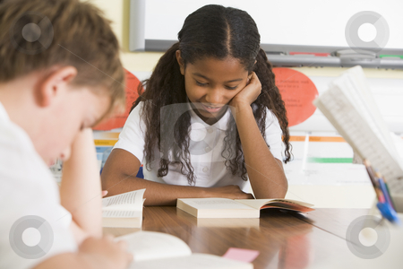 To use this stock image in your creative project, please select the size you need over to the right and click the "Add to Cart" button.
Your downloaded image will come with the Cutcaster watermark removed so don’t worry about the watermark you see on this page. Schoolchildren reading books in class stock photo, by Monkey Business Images