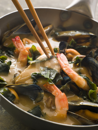 To use this stock image in your creative project, please select the size you need over to the right and click the "Add to Cart" button.
Your downloaded image will come with the Cutcaster watermark removed so don’t worry about the watermark you see on this page. Japanese Seafood and Wakame Seaweed Curry stock photo, Pan of Japanese Seafood and Wakame Seaweed Curry with chopsticks being held by Monkey Business Images