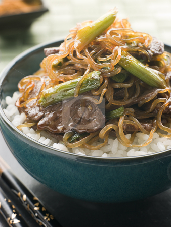 To use this stock image in your creative project, please select the size you need over to the right and click the "Add to Cart" button.
Your downloaded image will come with the Cutcaster watermark removed so don’t worry about the watermark you see on this page. Sweet Soy Beef Fillet with Shirataki Noodles on Rice stock photo, Bowl of Sweet Soy Beef Fillet with Shirataki Noodles on Rice with chopsticks by Monkey Business Images