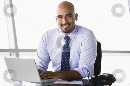 To use this stock image in your creative project, please select the size you need over to the right and click the "Add to Cart" button.
Your downloaded image will come with the Cutcaster watermark removed so don’t worry about the watermark you see on this page. Businessman working at desk stock photo, Businessman working at desk in office by Monkey Business Images