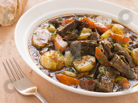To use this stock image in your creative project, please select the size you need over to the right and click the "Add to Cart" button.
Your downloaded image will come with the Cutcaster watermark removed so don’t worry about the watermark you see on this page. Rabo de Toro- Boneless Oxtail and Potato Stew stock photo, by Monkey Business Images
