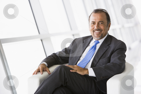 To use this stock image in your creative project, please select the size you need over to the right and click the "Add to Cart" button.
Your downloaded image will come with the Cutcaster watermark removed so don’t worry about the watermark you see on this page. Businessman relaxing in lobby stock photo, Business relaxing in office lobby by Monkey Business Images