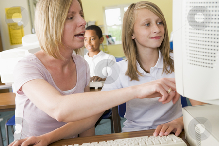 To use this stock image in your creative project, please select the size you need over to the right and click the "Add to Cart" button.
Your downloaded image will come with the Cutcaster watermark removed so don’t worry about the watermark you see on this page. Teacher and schoolgirl studying in front of a school computer stock photo, by Monkey Business Images