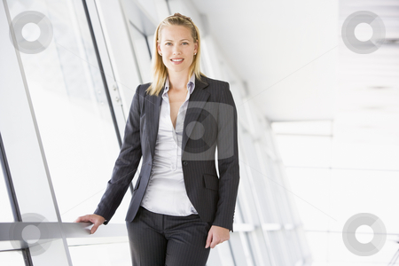 To use this stock image in your creative project, please select the size you need over to the right and click the "Add to Cart" button.
Your downloaded image will come with the Cutcaster watermark removed so don’t worry about the watermark you see on this page. Businesswoman standing in corridor smiling stock photo, by Monkey Business Images