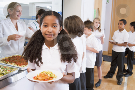 To use this stock image in your creative project, please select the size you need over to the right and click the "Add to Cart" button.
Your downloaded image will come with the Cutcaster watermark removed so don’t worry about the watermark you see on this page. Schoolgirl holding plate of lunch in school cafeteria stock photo, by Monkey Business Images