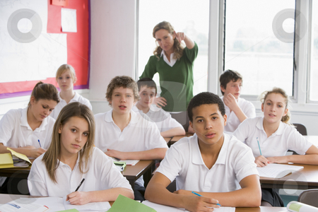 To use this stock image in your creative project, please select the size you need over to the right and click the "Add to Cart" button.
Your downloaded image will come with the Cutcaster watermark removed so don’t worry about the watermark you see on this page. High school students in class stock photo, by Monkey Business Images