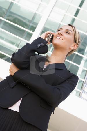 To use this stock image in your creative project, please select the size you need over to the right and click the "Add to Cart" button.
Your downloaded image will come with the Cutcaster watermark removed so don’t worry about the watermark you see on this page. Businesswoman standing outdoors using cellular phone and smiling stock photo, by Monkey Business Images