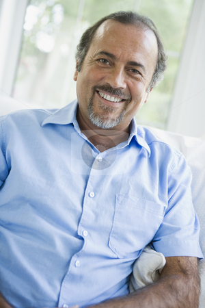 To use this stock image in your creative project, please select the size you need over to the right and click the "Add to Cart" button.
Your downloaded image will come with the Cutcaster watermark removed so don’t worry about the watermark you see on this page. A Middle Eastern man at home stock photo, by Monkey Business Images