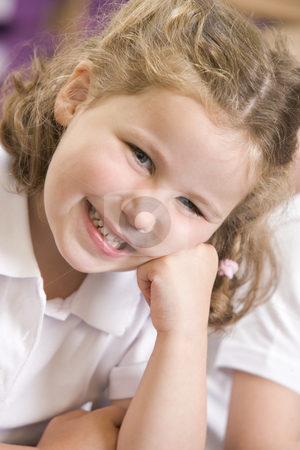 To use this stock image in your creative project, please select the size you need over to the right and click the "Add to Cart" button.
Your downloaded image will come with the Cutcaster watermark removed so don’t worry about the watermark you see on this page. Schoolgirl sitting in primary class stock photo, by Monkey Business Images