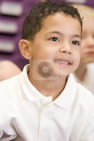 To use this stock image in your creative project, please select the size you need over to the right and click the "Add to Cart" button.
Your downloaded image will come with the Cutcaster watermark removed so don’t worry about the watermark you see on this page. Schoolboy sitting in primary class stock photo, by Monkey Business Images