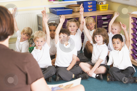 To use this stock image in your creative project, please select the size you need over to the right and click the "Add to Cart" button.
Your downloaded image will come with the Cutcaster watermark removed so don’t worry about the watermark you see on this page. Schoolchildren raise their hand in a primary class stock photo, by Monkey Business Images