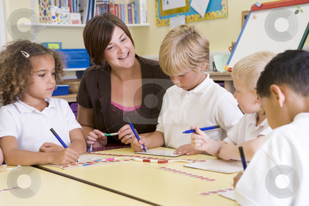 To use this stock image in your creative project, please select the size you need over to the right and click the "Add to Cart" button.
Your downloaded image will come with the Cutcaster watermark removed so don’t worry about the watermark you see on this page. Schoolchildren and their teacher in a primary class stock photo, by Monkey Business Images