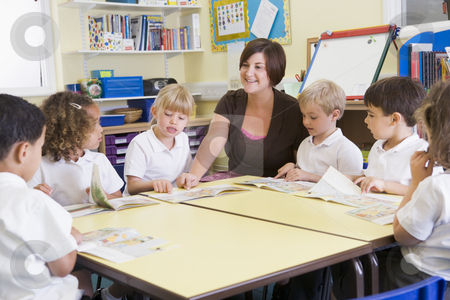 To use this stock image in your creative project, please select the size you need over to the right and click the "Add to Cart" button.
Your downloaded image will come with the Cutcaster watermark removed so don’t worry about the watermark you see on this page. Schoolchildren and their teacher reading in primary class stock photo, by Monkey Business Images