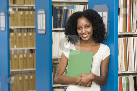 To use this stock image in your creative project, please select the size you need over to the right and click the "Add to Cart" button.
Your downloaded image will come with the Cutcaster watermark removed so don’t worry about the watermark you see on this page. University student working in library stock photo, University student holding book in library by Monkey Business Images