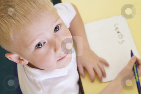 To use this stock image in your creative project, please select the size you need over to the right and click the "Add to Cart" button.
Your downloaded image will come with the Cutcaster watermark removed so don’t worry about the watermark you see on this page. Boy learning to write name in primary class stock photo, by Monkey Business Images