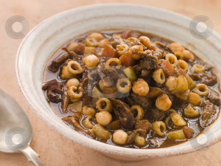 To use this stock image in your creative project, please select the size you need over to the right and click the "Add to Cart" button.
Your downloaded image will come with the Cutcaster watermark removed so don’t worry about the watermark you see on this page. Oxtail and Chickpea Winter Soup stock photo, by Monkey Business Images