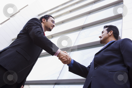 To use this stock image in your creative project, please select the size you need over to the right and click the "Add to Cart" button.
Your downloaded image will come with the Cutcaster watermark removed so don’t worry about the watermark you see on this page. Two businessmen shaking hands outside office building stock photo, Two businessmen shaking hands outside modern office building by Monkey Business Images